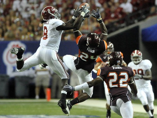 090905 Atlanta - Alabama WR Julio Jones (left, #8) and Virgina Tech ROV Dorian Porch (center, #24) hang in the air as Jones fails to catch the ball in the first half action Saturday night at Georgia Dome. Alabama comes into the Chick fil A game against Virginia Tech in a much better position than a year ago. Alabama returns as a Top 10 team to face ACC power Virginia Tech. Saturday, September 5, 2009. Hyosub Shin, hshin@ajc.com